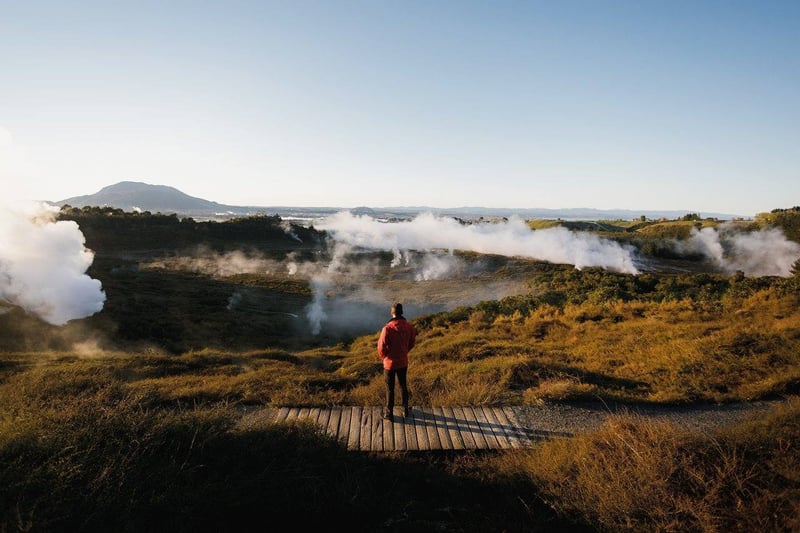 2504 img taupo town craters of the moon geothermal man staanding on walkway steam autumn